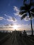 People walk out to Pier to watch Sunset in Waikiki