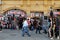 People walk past a popular souvenirs shop