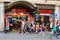 People walk past a popular souvenirs shop