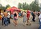 People walk in the pedestrian area on a summer day during the annual Intl festival of music and crafts World of Siberia.