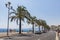 People walk on Promenade des Anglais in Nice, France