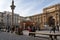 People walk in the Republic square ital. Piazza della Repubblica with a children`s carousel, the arch of Victor Emmanuel II.