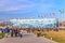 People walk round Olympic Park during Winter Olympics in Sochi in 2014. Scenic townscape with Iceberg Ice Palace and flags on