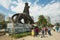 People walk by the street next to the iconic statue of the Lion of Judah in Addis Ababa, Ethiopia.