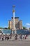 People walk, take pictures and relax in front of Independence Monument with the Statue of Berehynia at the top, Maidan Nezalezhnos