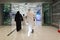 People walk to entrance to Dubai metro station at EXPO 2020. Modern design of underground station