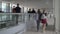 People walking through the airport passageway