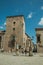 People walking on alley with gothic mansion at Avila