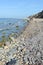 People walking along on Baltic sea beach and cliff of villages names Ahrenshoop and Wustrow Mecklenburg-Vorpommern, Germany