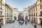 People walking along through the Karlstor gate in Munich