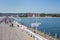 People walking along the Sopot Pier Molo, the longest wooden pier in Europe, Poland.