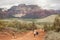 People walking along the triail that leads to Devils Bridge in Sedona,