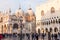 People walking around the Doge`s Palace and San Marco Basilica, Venice, Italy