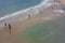 People walking on the beach of La Concha in the city of Donostia