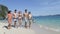 People Walking On Beach Talking, Girl Point Finger Young Tourists Group On Sea Resort Thailand