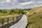 People walking on boardwalk, Wittdun dunes, Amrum island, North Frisia, Schleswig-Holstein, Germany