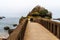 People walking through the bridge at the Rock of Basta, Biarritz, France