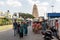 People walking on a busy street leading to the ancient Hindu temple of Chamundeshwari at