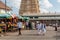 People walking on a busy street leading to the ancient Hindu temple of Chamundeshwari at