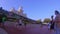 People walking close to Main Street Station at  Magic Kingdom.