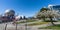 People walking and cycling on Creekside Park seawall trail in springtime. Vancouver, BC, Canada