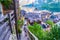 People walking down on narrow old stairs above Hallstatt, with breathtaking views of Lake Hallstatt Hallstatter See