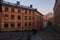 People walking down a Swedish cobblestone street in Sodermalm at Christmas, south Stockholm, Sweden.