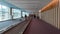 People walking down the transit walkway in Incheon International airport.