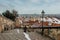 People walking downstairs from Prague Castle to Lesser Town, Czech Republic.Panoramic view of historical buildings,red