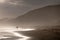 People walking in the far distance on the sandy beach at Brenton on Sea, photographed at sundown. Knysna, South Africa.