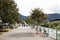 People walking on the footpath at riverside of passer river at Meran city