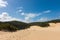 People walking through the Fraser Island sand dunes to get to lake Wabby