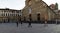 People walking in front of the Basilica called `San Lorenzo` in the place called San Lorenzo