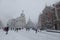 People walking in front of the Metropolis building on a snowy day, Madrid