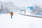 People walking on a highway in the city covered in snow during heavy snowfall storm in Madrid