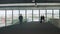 People walking with luggage in airport waiting hall, business trip, tourism