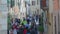 People walking in the main street of San Quirico D`Orcia, Siena