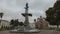 People walking through Maldonado park with the Cathedral Church of Riobamba in the background