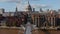 People walking on Millennium footbridge over River Thames. Forwards fly towards Saint Pauls Cathedral with large dome