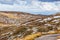 People walking on Mount Kosciuszko summit walk. Snowy Mountains, Australia