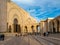 People walking near the ornate gates of the Mosque Hassan II Casablanca, Morocco