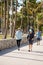 People walking on Ocean Drive pedestrian pathway street photography