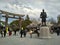 People walking at Osaka castle area, a samurai sculpture, old gate shrine with cloudy sky, Osaka 2016