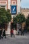 People walking out of the Tourist Office located on Plaza del Triunfo, Seville, Spain