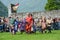 People walking during a parade of medieval characters