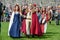 People walking during a parade of medieval characters