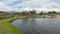 People walking in the park next to the Colta Lagoon on a cloudy day - Ecuador