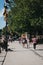 People walking past colourful bunting along the River Thames in