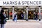 People Walking Past High Street Retailer Marks And Spencer During Covid-19