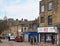 People walking past old buildings and shops in oastler square and north parade in bradford west yorkshire